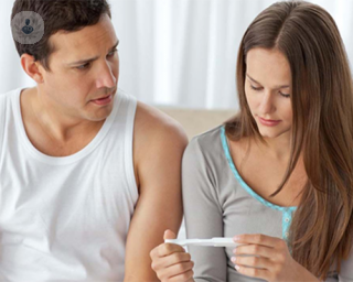 A couple receiving pregnancy test results