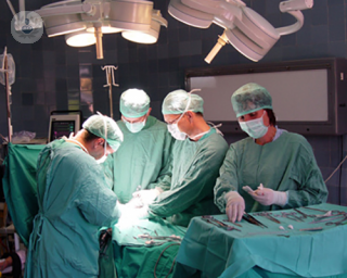 doctors performing surgery in theatre