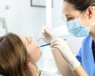 Dentist checking a patient's mouth and teeth