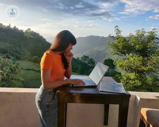 woman working on her laptop outdoors