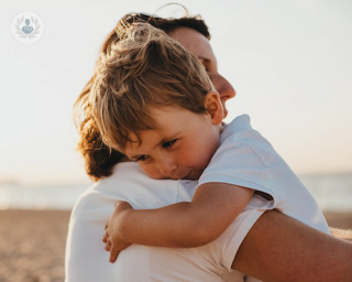 little boy with mother at the beach