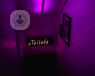 neon toilet sign with purple background