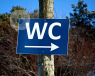 Sign for the WC which is a place where people may noticed benign prostate enlargement symptoms