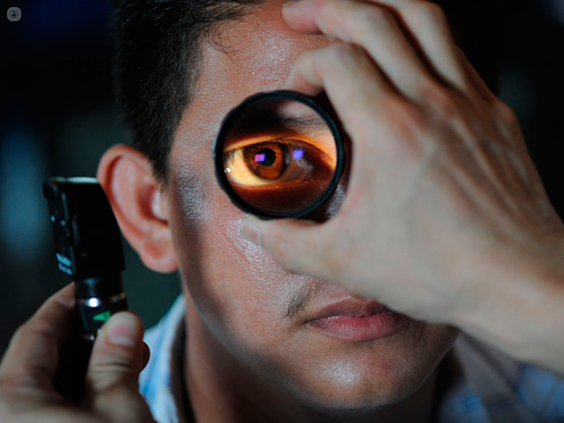Man having an gonioscopy which is a neuro-ophthalmology technique to diagnose angle-closure glaucoma