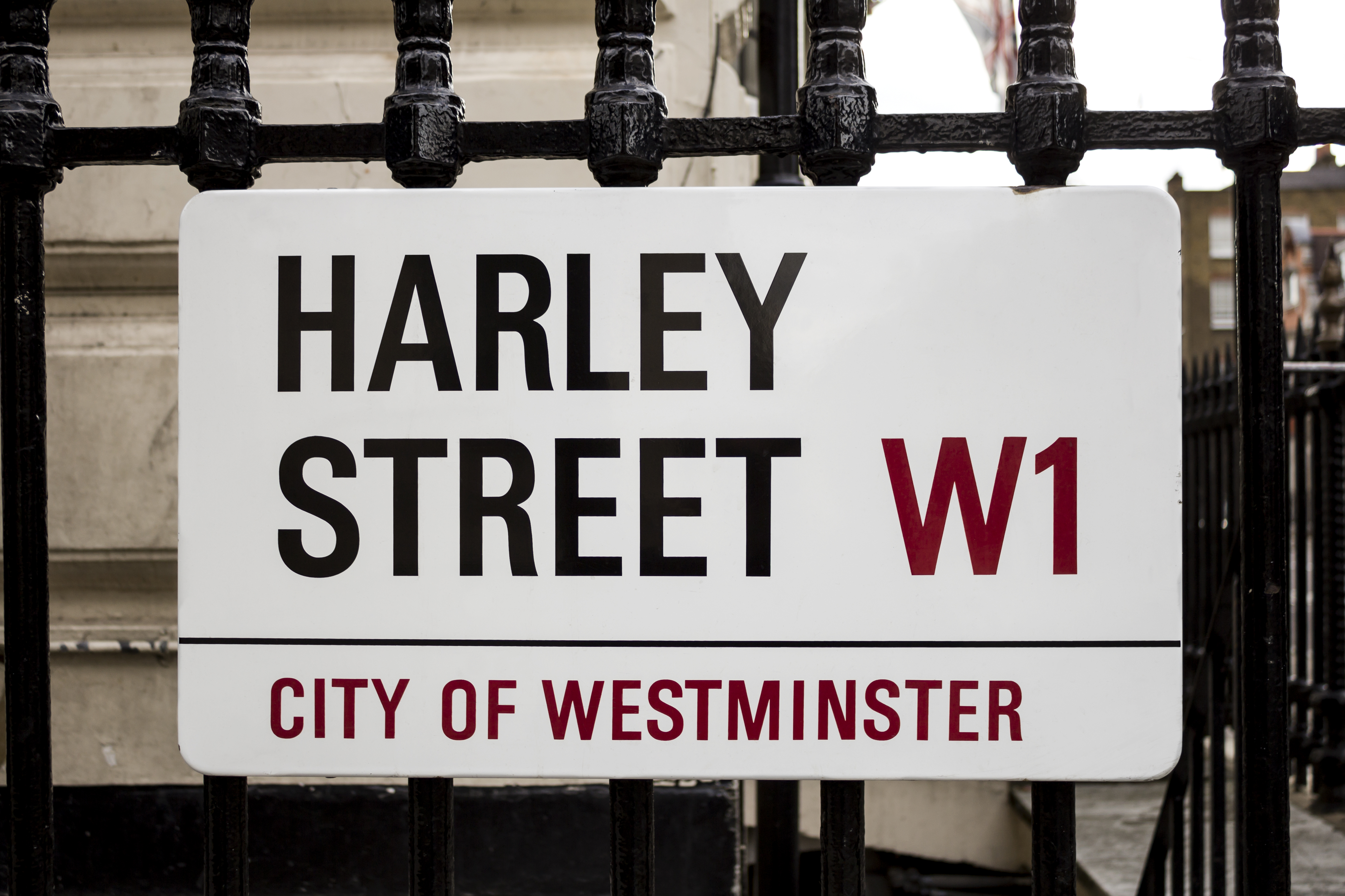 A Street sign of Harley Street, W1, City of Westminster