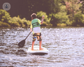 floating child on paddleboard