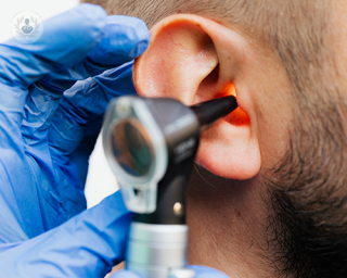 An ear examination using an otoscope