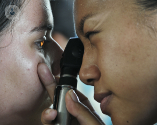 Young girl having an eye exam to diagnose diabetic retinopathy