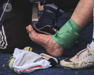 Man with a sports ankle injury getting treated