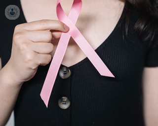 woman with breast cancer ribbon