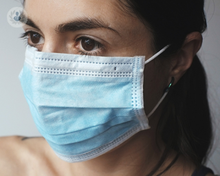 Girl wearing a blue COVID face mask