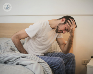 man waking up with back pain
