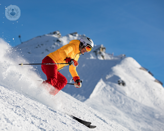 A skier moving down a slope