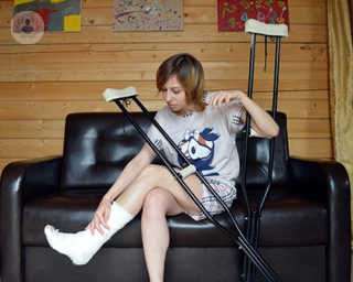 A girl with crutches