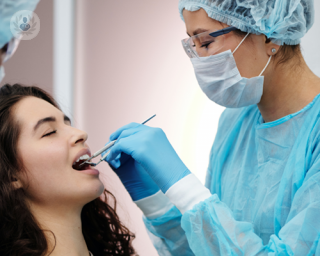 Apicture of a dentist treating a patient 
