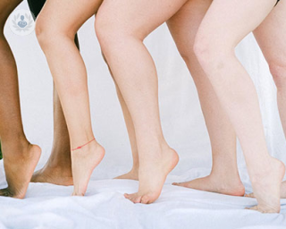 a picture of women standing in a row showing their legs