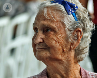 An elderly woman looking sideways