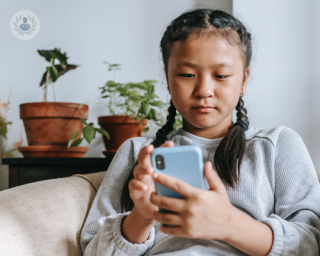 A girl using an AI child and adolescent mental health service