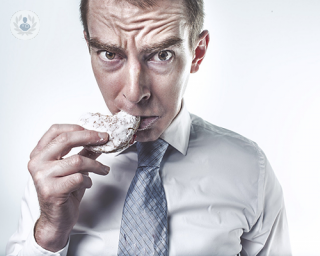 A man eating a rice cake.