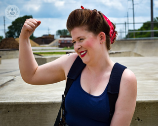 Woman showing her arm muscles