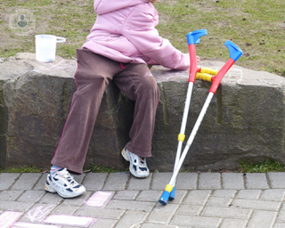 An image of a child with crutches