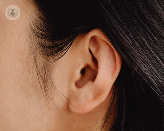 A closeup image of a girl's left ear