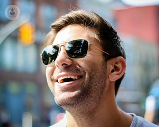 A happy man wearing sunglasses
