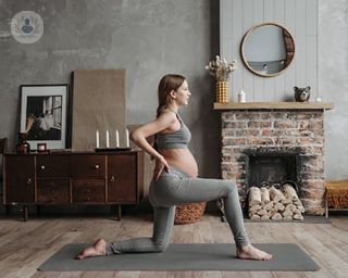 a woman exercising while pregnant