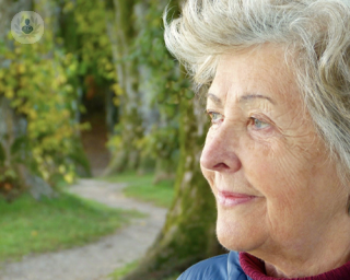 Older woman thinking about having a hip replacement