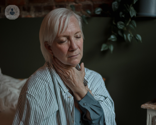 Elderly woman with neck pain