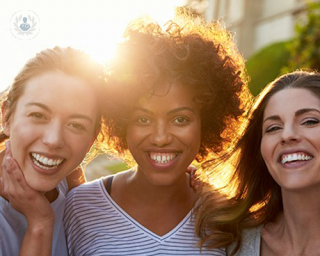 Young women with high self-esteem, smiling in the sunshine