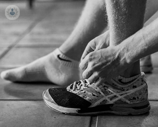 Black & white photo of sports person's ankle