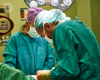 Surgeons doing surgery.