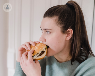 A girl eating a hamburger