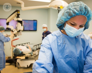 An image of a surgeon preparing for surgery