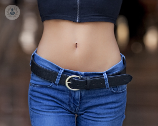 Women showing off her flat stomach