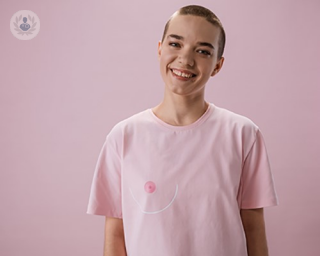 A woman wearing a breast cancer t-shirt