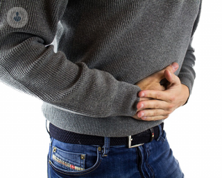 Man holding abdominal in pain