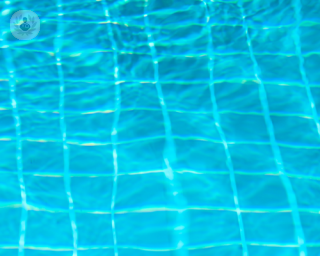 A picture of pool tiles refracting underwater 