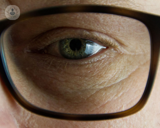 Closeup of man wearing glasses.