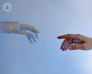 an image of a hand and robot