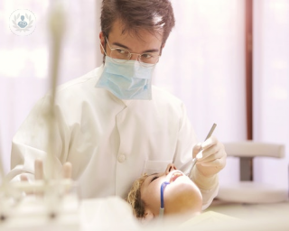 A dentist performing a deep clean
