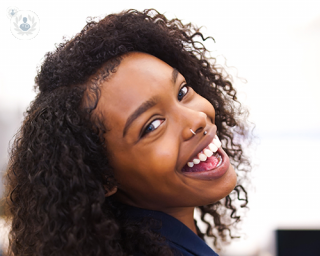 woman smiling showing her good teeth