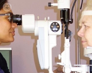 Miss Amerasinghe examining a patient's eye