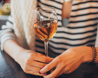 Woman holding a glass of wine