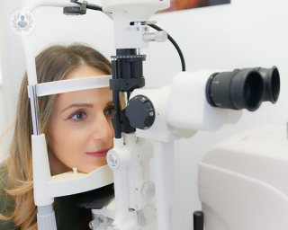 A woman getting her eyes tested.