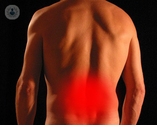 A red haze over a man's lower back to signify lower back pain.