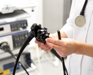 Doctor holding an endoscope used for gastrointestinal tests such as a colonoscopy or polypectomy. 