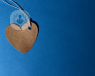 An image of a paper heart attached to a string
