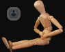 wooden stick figure holding stomach in pain